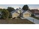 House exterior at dusk, featuring a metal roof at 428 Rose Apple Cir, Port Charlotte, FL 33954