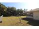 Large backyard with grassy area and partial home view at 4330 Shappell St, Port Charlotte, FL 33948