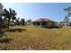 Spacious backyard with grassy area and shed at 4330 Shappell St, Port Charlotte, FL 33948