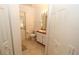Clean bathroom with toilet, sink, and access to exterior at 4330 Shappell St, Port Charlotte, FL 33948
