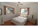 Bedroom with floral bedding, nightstand, and window at 4330 Shappell St, Port Charlotte, FL 33948