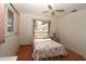 Bedroom with floral bedding, nightstand, and window at 4330 Shappell St, Port Charlotte, FL 33948