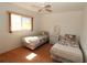 Bedroom with twin beds, nightstand, and window at 4330 Shappell St, Port Charlotte, FL 33948