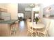 Bright dining area with table and chairs adjacent to the kitchen at 4330 Shappell St, Port Charlotte, FL 33948