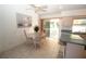 Charming dining area with round table and chairs near kitchen at 4330 Shappell St, Port Charlotte, FL 33948