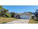 One-story house with a spacious yard and a two-car garage at 4330 Shappell St, Port Charlotte, FL 33948