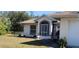 House exterior showcasing front entrance with screen door and landscaping at 4330 Shappell St, Port Charlotte, FL 33948