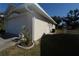 Single car garage with a concrete driveway and landscaping at 4330 Shappell St, Port Charlotte, FL 33948