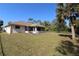 Back exterior of house with screened patio at 4330 Shappell St, Port Charlotte, FL 33948