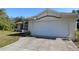 House front view showcasing a single-car garage and well-maintained landscaping at 4330 Shappell St, Port Charlotte, FL 33948