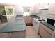Bright kitchen with island, stainless steel sink, and ample cabinet space at 4330 Shappell St, Port Charlotte, FL 33948