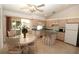 Kitchen with island, wood cabinets, and adjacent dining area at 4330 Shappell St, Port Charlotte, FL 33948