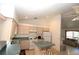 Open kitchen features an island and views into the living room at 4330 Shappell St, Port Charlotte, FL 33948