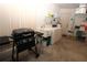 Laundry room with grill, washer, dryer, and shelving at 4330 Shappell St, Port Charlotte, FL 33948