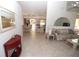 Bright living room with tiled floors and floral sofa at 4330 Shappell St, Port Charlotte, FL 33948