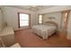 Spacious main bedroom with large windows and carpeted flooring at 4330 Shappell St, Port Charlotte, FL 33948
