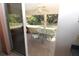 Relaxing screened patio with table and chairs, perfect for outdoor dining at 4330 Shappell St, Port Charlotte, FL 33948