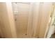 Large walk-in shower with neutral tile and a shower curtain at 4330 Shappell St, Port Charlotte, FL 33948