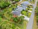 Aerial view of home with large backyard, pool, and canal access at 472 Eppinger Dr, Port Charlotte, FL 33953