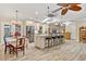 Spacious kitchen features granite countertops, stainless steel appliances, and an island with seating at 472 Eppinger Dr, Port Charlotte, FL 33953
