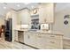 Bright kitchen with white cabinets, granite countertops, and stainless steel appliances at 472 Eppinger Dr, Port Charlotte, FL 33953