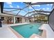 Relaxing pool area, screened enclosure, and view of the home's interior at 472 Eppinger Dr, Port Charlotte, FL 33953