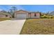 Newly constructed home with a single car garage and spacious lawn at 5389 Ocarina Rd, North Port, FL 34291