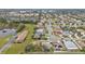 Community view showcasing numerous houses and green spaces at 5608 New Covington Dr, Sarasota, FL 34233