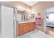 Double vanity bathroom with shower and built in storage at 5608 New Covington Dr, Sarasota, FL 34233