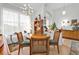 Bright dining room featuring a round table and two chairs at 5608 New Covington Dr, Sarasota, FL 34233
