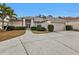 One story house with a two-car garage and manicured lawn at 5608 New Covington Dr, Sarasota, FL 34233