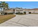 One-story house with driveway and landscaping at 5608 New Covington Dr, Sarasota, FL 34233