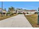 Single-story house with driveway and landscaping at 5608 New Covington Dr, Sarasota, FL 34233