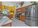 Bright kitchen features stainless steel appliances and marble countertops at 5608 New Covington Dr, Sarasota, FL 34233