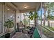 Cozy screened porch, perfect for relaxing, with wicker furniture at 5608 New Covington Dr, Sarasota, FL 34233