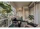 Peaceful screened porch with wicker chairs and potted plants at 5608 New Covington Dr, Sarasota, FL 34233