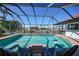 Relaxing pool area with canal view from lanai at 561 Via Esplanade, Punta Gorda, FL 33950