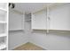 Bright walk-in closet with white shelves and rods at 601 Shreve St # 35C, Punta Gorda, FL 33950