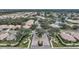 Aerial view of community entrance and residential homes at 6049 Grand Cypress Blvd, North Port, FL 34287