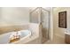 Bathroom with soaking tub and shower at 6049 Grand Cypress Blvd, North Port, FL 34287
