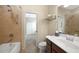 Bright bathroom with a tub, toilet and vanity at 6049 Grand Cypress Blvd, North Port, FL 34287