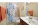 Clean bathroom with shower/tub combo, vanity, and updated fixtures at 6049 Grand Cypress Blvd, North Port, FL 34287