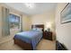 Bedroom with a double bed and wood nightstand at 6049 Grand Cypress Blvd, North Port, FL 34287