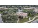 Aerial view of community center near lake and walking path at 6049 Grand Cypress Blvd, North Port, FL 34287
