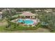 Aerial view of community pool with lounge chairs and landscaping at 6049 Grand Cypress Blvd, North Port, FL 34287