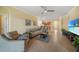 Living room, view of kitchen and access to backyard at 6049 Grand Cypress Blvd, North Port, FL 34287