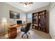 Home office with built-in shelves and a large desk at 6049 Grand Cypress Blvd, North Port, FL 34287