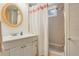 Clean bathroom with a tub shower combo and updated vanity at 6305 Parkview Ct, North Port, FL 34287