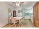 Charming dining area with a table and four chairs adjacent to the kitchen at 6305 Parkview Ct, North Port, FL 34287