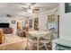 Bright dining area with seating for four overlooking the living room at 6305 Parkview Ct, North Port, FL 34287